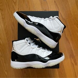 Air Jordan 11 Retro in white metallic gold black